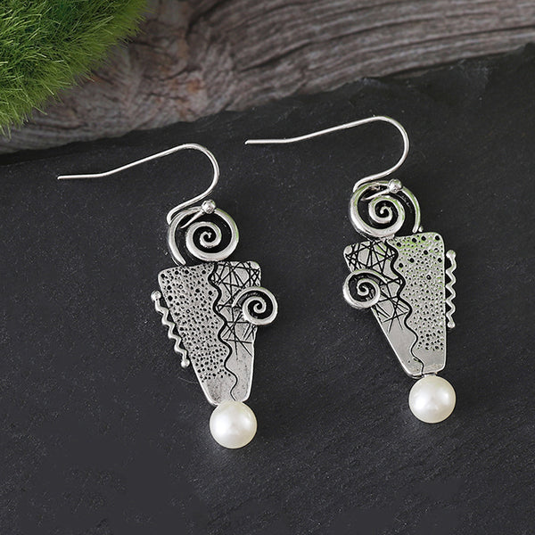 Inverted triangle with pearl earrings