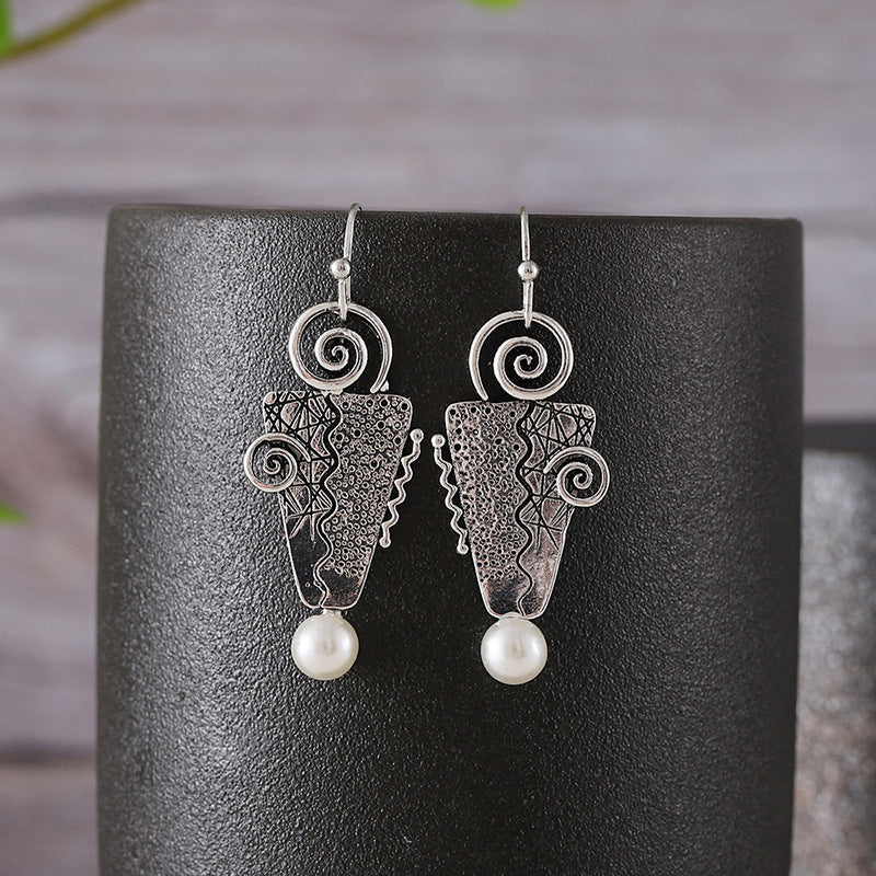 Inverted triangle with pearl earrings