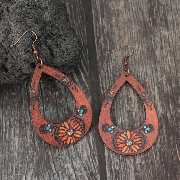 Droplet shaped hollow engraved earrings