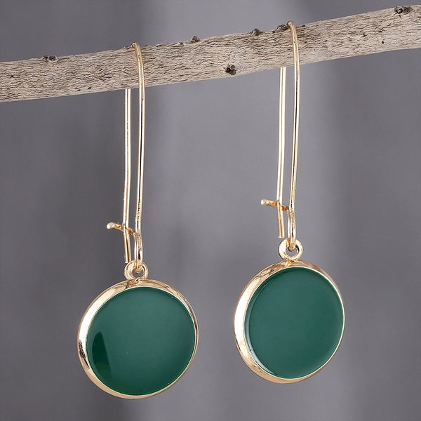 Green circular earrings