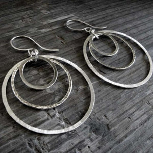 Large circular alloy earrings